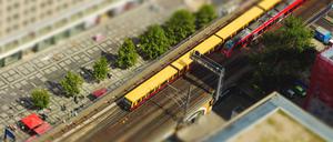 Aerial view of the S-Bahn tracks rapid train and tram train at the Alexanderplatz public square in Berlin. with tilt-shift effect.