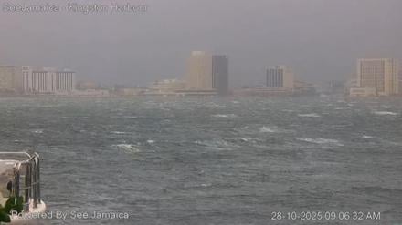 Video grab courtesy of a SeeJamaica CCTV camera shows Kingston harbour on October 28, 2025 ahead of Hurricane Melissa's expected landfall on Tuesday. The Category 5 storm -- which could be Jamaica's most violent on record -- is charting a painstakingly slow path through the Caribbean, and has already been blamed for three deaths in Jamaica, three in Haiti and one in the Dominican Republic. (Photo by HANDOUT / SEE JAMAICA / AFP) / - NO Marketing campaign / --- RESTRICTED TO EDITORIAL USE - MANDATORY CREDIT "AFP PHOTO / SEEJAMAICA " - NO MARKETING - NO ADVERTISING CAMPAIGNS - DISTRIBUTED AS A SERVICE TO CLIENTS  ===