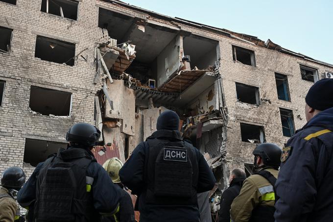 Emergency employees look at a dormitory building heavily damaged during an overnight Russian missile and drone strikes, amid Russia's attack on Ukraine, in Zaporizhzhia, Ukraine October 30, 2025. REUTERS/Stringer