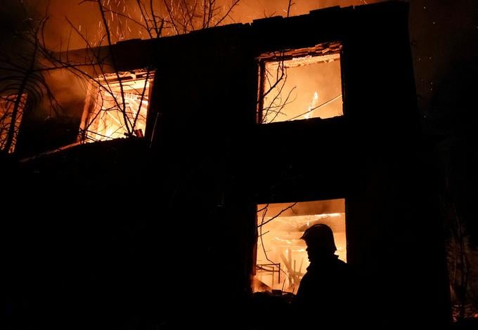 A firefighter works at the site of a Russian drone strike, amid Russia's attack on Ukraine, in Chuhuiv, Kharkiv region, Ukraine November 7, 2025. REUTERS/Sofiia Gatilova     TPX IMAGES OF THE DAY     