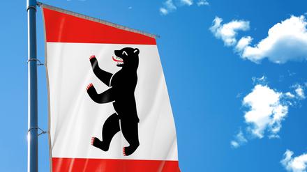 Bavaria, Germany - November 21, 2024: Flag of the federal state of Berlin waving majestically in the wind - a symbol of Berlin culture, politics and tradition in Germany. PHOTOMONTAGE *** Fahne des Bundesland Berlin weht majestätisch im Wind ein Symbol für Berliner Kultur, Politik und Tradition in Deutschland. FOTOMONTAGE