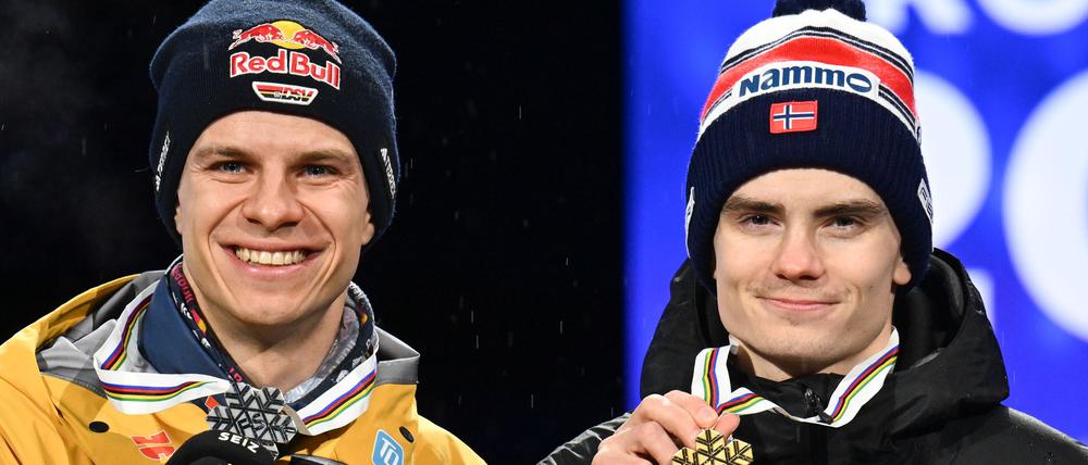Andreas Wellinger (l.), der bei der WM Silber gewann, ist noch immer nicht gut auf Marius Lindvik zu sprechen, nachdem dieser in manipiulierten Anzügen gesprungen war. Seine Goldmedaille war dem Norweger nicht aberkannt worden. 