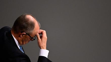German Chancellor Friedrich Merz reacts during a general debate on the budget of the Federal Chancellery at the Bundestag, Germany's lower house of parliament in Berlin on November 26, 2025. (Photo by Tobias SCHWARZ / AFP)