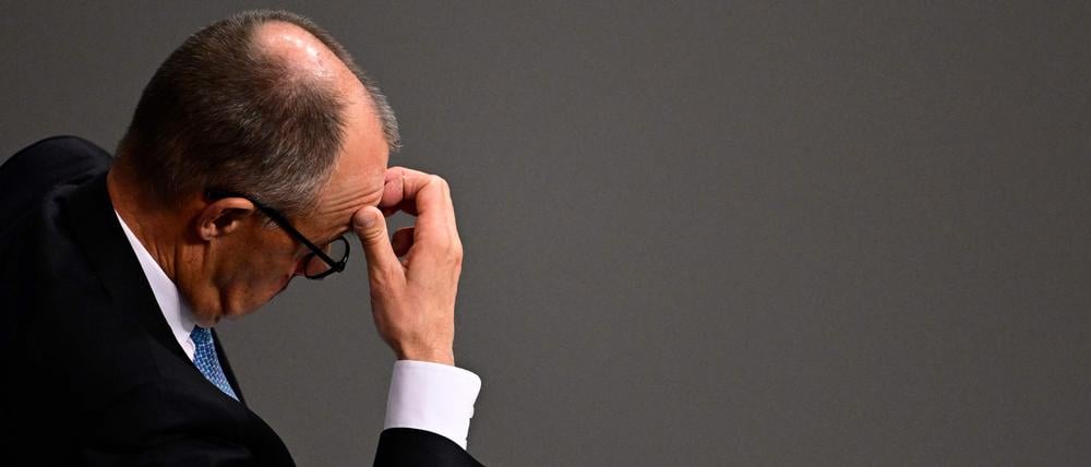 German Chancellor Friedrich Merz reacts during a general debate on the budget of the Federal Chancellery at the Bundestag, Germany's lower house of parliament in Berlin on November 26, 2025. (Photo by Tobias SCHWARZ / AFP)