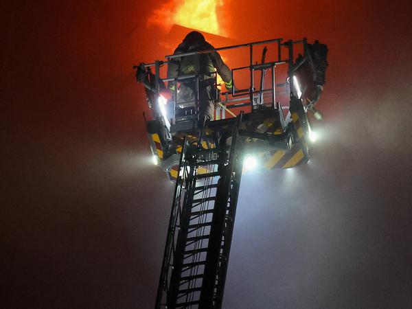 A firefighters works at the scene, after a started fire burning bamboo scaffolding across multiple buildings at Wang Fuk Court housing estate, in Tai Po, Hong Kong, China, November 26, 2025. REUTERS/Tyrone Siu