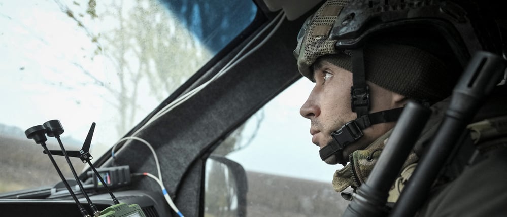 A member of the White Angels police evacuation unit rides in an armoured vehicle during an evacuation from the frontline town of Pokrovske, amid Russia's attack on Ukraine, in Dnipropetrovsk region, Ukraine November 11, 2025. REUTERS/Stringer