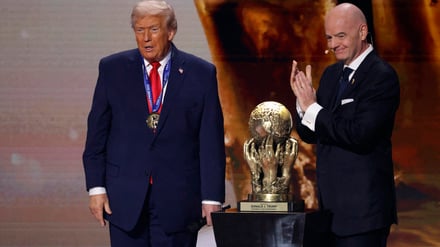 Dec 5, 2025; Washington, District of Columbia, USA; FIFA president Gianni Infantino presents United States President Donald Trump with the FIFA Peace Prize during the FIFA World Cup 2026 Final Draw at John F. Kennedy Center for the Performing Arts. Mandatory Credit: Amber Searls-Imagn Images