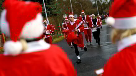 People dressed as Santa Claus run through the streets as they take part in the annual 'Nikolauslauf' in Michendorf, Germany, December 7, 2025. REUTERS/Lisi Niesner