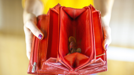 Woman hand holding empty wallet