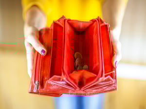 Woman hand holding empty wallet