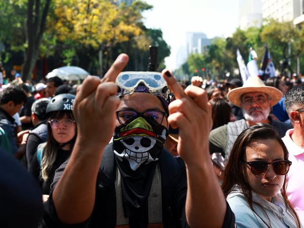 SENSITIVE MATERIAL. THIS IMAGE MAY OFFEND OR DISTURB A protester gestures during a demonstration organised by the "Generation Z" against corruption and violence, in Mexico City, Mexico, November 20, 2025. REUTERS/Raquel Cunha