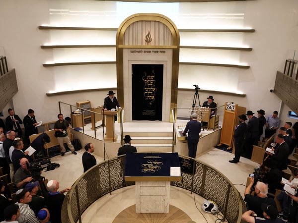 Rabbi Yehoram Ulman speaks during a vigil at Chabad of Bondi synagogue, after a shooting at Bondi Beach in Sydney, Australia, December 15, 2025. REUTERS/Hollie Adams