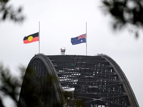 Flags fly at half mast on the Sydney Harbour Bridge in Sydney, Australia, December 15, 2025. Australia is in mourning after gunmen opened fire on Bondi Beach, an attack designed to target the Jewish community. AAP/Steven Markham via REUTERS ATTENTION EDITORS - THIS IMAGE WAS PROVIDED BY A THIRD PARTY. NO RESALES. NO ARCHIVE. AUSTRALIA OUT. NEW ZEALAND OUT. NO COMMERCIAL OR EDITORIAL SALES IN NEW ZEALAND. NO COMMERCIAL OR EDITORIAL SALES IN AUSTRALIA.