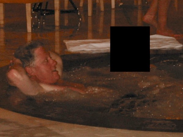 This photo provided by the US Justice Department on December 19, 2025 shows an undated picture of former US president Bill Clinton in a jacuzzi at an undisclosed location as the Justice Department began releasing the long-awaited records from the investigation into the politically explosive case of convicted sex offender Jeffrey Epstein. (Photo by Handout / US DEPARTMENT OF JUSTICE / AFP) / RESTRICTED TO EDITORIAL USE - MANDATORY CREDIT "AFP PHOTO / US Department of Justice" - NO MARKETING NO ADVERTISING CAMPAIGNS - DISTRIBUTED AS A SERVICE TO CLIENTS