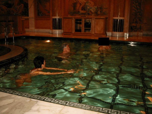 Former U.S. President Bill Clinton swims in a pool in this image released by the Department of Justice in Washington, D.C., U.S., on December 19, 2025 as part of a new trove of documents from its investigations into the late financier and convicted sex offender Jeffrey Epstein. U.S. Justice Department/Handout via REUTERS THIS IMAGE HAS BEEN SUPPLIED BY A THIRD PARTY REDACTED AREAS FROM SOURCE. THIS PICTURE WAS PROCESSED BY REUTERS TO ENHANCE QUALITY. AN UNPROCESSED VERSION HAS BEEN PROVIDED SEPARATELY.