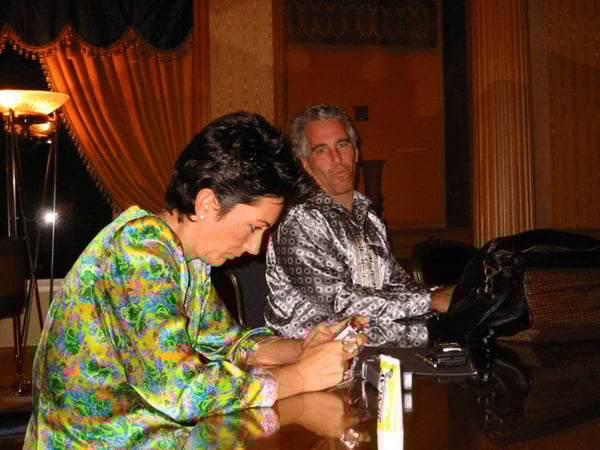 Jeffrey Epstein and Ghislaine Maxwell are seen in this image released by the Department of Justice in Washington, D.C., U.S., on December 19, 2025 as part of a new trove of documents from its investigations into the late financier and convicted sex offender Jeffrey Epstein. U.S. Justice Department/Handout via REUTERS THIS IMAGE HAS BEEN SUPPLIED BY A THIRD PARTY REDACTED AREAS FROM SOURCE. THIS PICTURE WAS PROCESSED BY REUTERS TO ENHANCE QUALITY. AN UNPROCESSED VERSION HAS BEEN PROVIDED SEPARATELY.