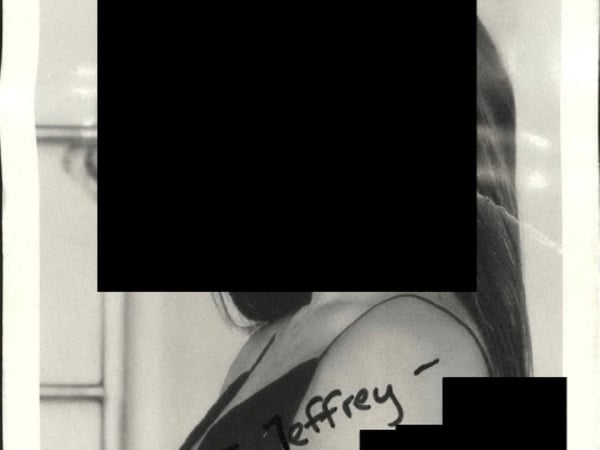A photo with "To Jeffrey" written on it is seen in this image released by the Department of Justice in Washington, D.C., U.S., on December 19, 2025 as part of a new trove of documents from its investigations into the late financier and convicted sex offender Jeffrey Epstein. U.S. Justice Department/Handout via REUTERS THIS IMAGE HAS BEEN SUPPLIED BY A THIRD PARTY REDACTED AREAS FROM SOURCE. THIS PICTURE WAS PROCESSED BY REUTERS TO ENHANCE QUALITY. AN UNPROCESSED VERSION HAS BEEN PROVIDED SEPARATELY.