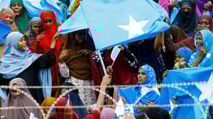 Women wave Somali national flags, as they attend a demonstration after Israel became the first country to formally recognize the self-declared Republic of Somaliland as an independent and sovereign state, a decision that could reshape regional dynamics and test Somalia's longstanding opposition to secession, at the Mogadishu Stadium in Warta Nabada district of Mogadishu, Somalia December 30, 2025. REUTERS/Feisal Omar