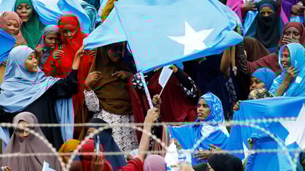 Women wave Somali national flags, as they attend a demonstration after Israel became the first country to formally recognize the self-declared Republic of Somaliland as an independent and sovereign state, a decision that could reshape regional dynamics and test Somalia's longstanding opposition to secession, at the Mogadishu Stadium in Warta Nabada district of Mogadishu, Somalia December 30, 2025. REUTERS/Feisal Omar