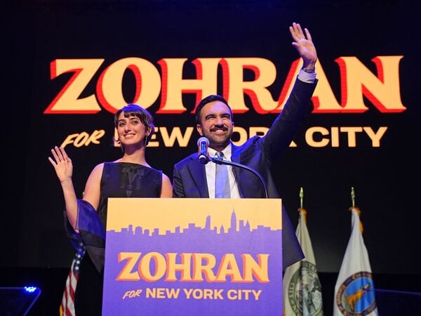 (FILES) New York City Mayoral candidate Zohran Mamdani (R) celebrates alongside his wife Rama Duwaji (L) during an election night event at the Brooklyn Paramount Theater in Brooklyn, New York on November 4, 2025. New York mayor-elect Zohran Mamdani is set to become the US city's first Muslim mayor, and the youthful optimism of his Democratic Socialist platform will be put to the test as he takes office on January 1, 2026, with high expectations. (Photo by Angelina Katsanis / AFP)
