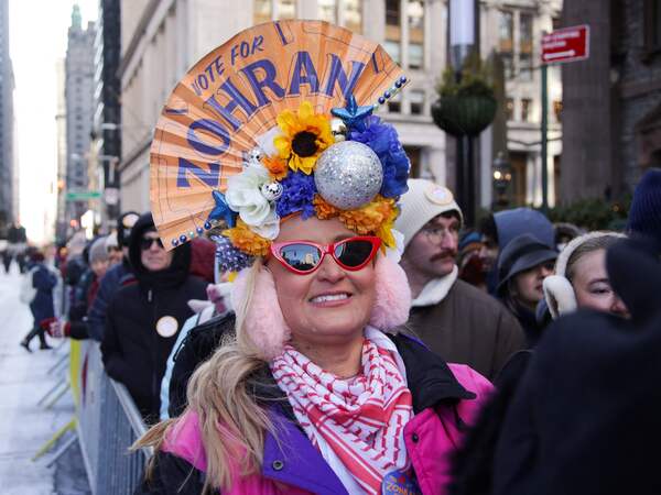 A woman attends the Inauguration for a New Era Block Party in New York City on January 1, 2026. Mamdani, the young upstart of the US left, was sworn in Thursday to take over as New York mayor for a term sure to see him cross swords with President Donald Trump. After the clocks struck midnight, bringing in 2026, Mamdani took his oath of office at an abandoned subway stop to begin managing the United States' largest city. He is New York's first Muslim mayor. (Photo by Leonardo Munoz / AFP)