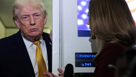 U.S. President Donald Trump listens to a reporter’s question aboard Air Force One en route from Florida to Joint Base Andrews, Maryland, U.S., January 4, 2026. REUTERS/Jonathan Ernst