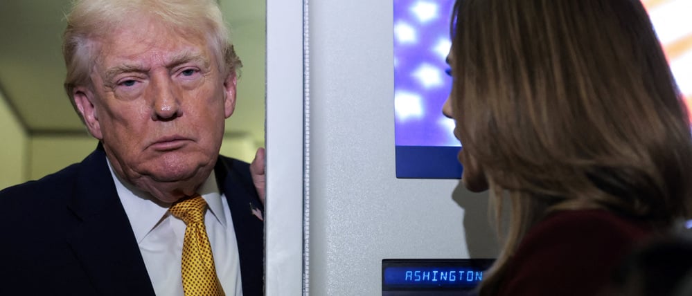 U.S. President Donald Trump listens to a reporter’s question aboard Air Force One en route from Florida to Joint Base Andrews, Maryland, U.S., January 4, 2026. REUTERS/Jonathan Ernst