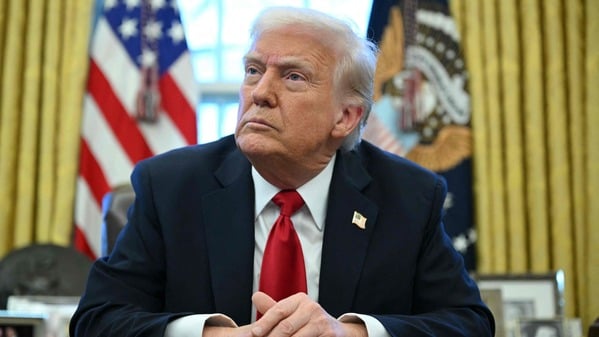 (FILES) US President Donald Trump announces tariffs on auto imports in the Oval Office of the White House in Washington, DC, on March 26, 2025. Venezuela on January 3, 2026, demanded an emergency meeting of the UN Security Council to discuss the US military strikes on the country, amid uncertainty over the whereabouts of President Nicolas Maduro, after President Donald Trump said that US forces had captured the Venezuelan leader after launching a "large scale strike" on the South American country. (Photo by Mandel NGAN / AFP)