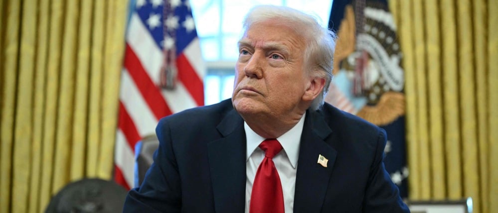 (FILES) US President Donald Trump announces tariffs on auto imports in the Oval Office of the White House in Washington, DC, on March 26, 2025. Venezuela on January 3, 2026, demanded an emergency meeting of the UN Security Council to discuss the US military strikes on the country, amid uncertainty over the whereabouts of President Nicolas Maduro, after President Donald Trump said that US forces had captured the Venezuelan leader after launching a "large scale strike" on the South American country. (Photo by Mandel NGAN / AFP)