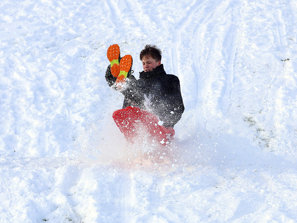 A youth sleighs in the snow, as cold weather warnings are extended into next week by Britain's Met Office, in Glenariffe, Northern Ireland, January 4, 2026. REUTERS/Cathal McNaughton
     TPX IMAGES OF THE DAY     
EU_Snow