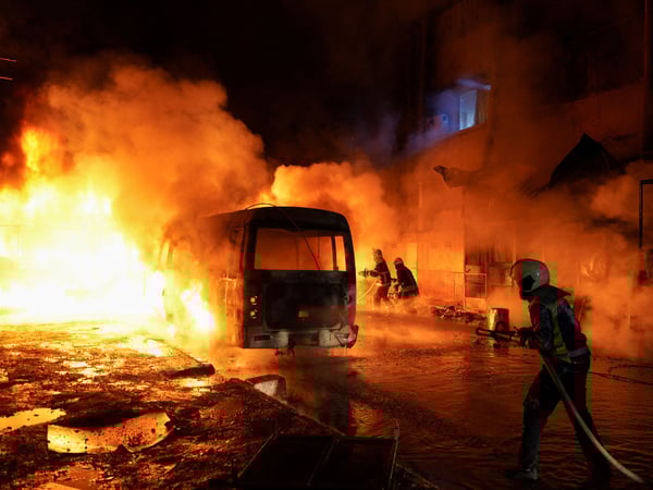 Members of the Syrian Civil Defence work to extinguish a fire after shelling amid renewed clashes between the Syrian army and the Syrian Democratic Forces in Aleppo, Syria, January 8, 2026. REUTERS/Karam al‑Masri TPX IMAGES OF THE DAY