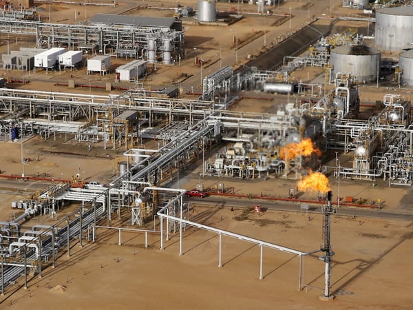 FILE PHOTO: A flame burning natural gas is seen at an heavy-crude treatment plant operated by Venezuela's state oil company PDVSA, in the oil rich Orinoco belt, near Cabrutica at the state of Anzoategui April 16, 2015. Picture taken on April 16, 2015. REUTERS/Carlos Garcia Rawlins/File Photo