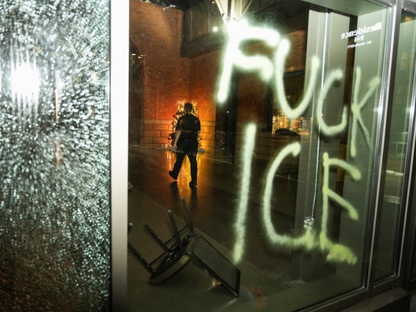  SENSITIVE MATERIAL. THIS IMAGE MAY OFFEND OR DISTURB   A man walks at the Renaissance Minneapolis Hotel, The Depot, behind a vandalized glass panel, amidst a demonstration against increased immigration enforcement, days after the fatal shooting of Renee Nicole Good by a U.S. Immigration and Customs Enforcement (ICE) agent, in Minneapolis, Minnesota, U.S., January 9, 2026.  REUTERS/Tim Evans 