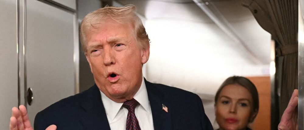 US President Donald Trump speaks to the press aboard Air Force One on January 11, 2026. Trump said Sunday his administration was working well with Venezuela's interim leader Delcy Rodriguez and that he would be open to meeting with her. (Photo by ANDREW CABALLERO-REYNOLDS / AFP)