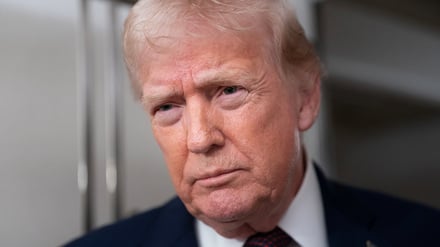 U.S. President Donald Trump speaks with members of the media aboard Air Force One en route from Florida to Joint Base Andrews, Maryland, U.S., January 11, 2026. REUTERS/Nathan Howard