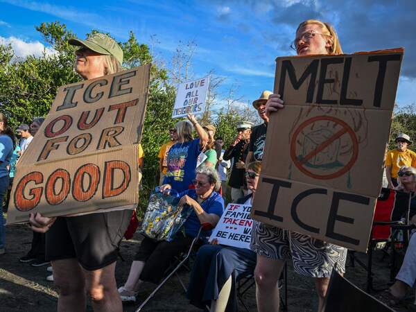 Demonstrators protest against Immigration and Customs Enforcement (ICE) and demanding the closure of the immigrant detention center known as "Alligator Alcatraz" outside the center at the Dade-Collier Training and Transition Airport in Ochopee, Florida, on January 11, 2026. A US Immigration and Customs Enforcement (ICE) agent shot and killed 37-year-old Renee Nicole Good on the streets of Minneapolis on January 7, leading to huge protests and outrage from local leaders who rejected White House claims she was a domestic terrorist. (Photo by Giorgio VIERA / AFP)