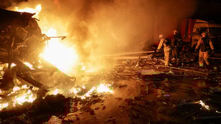 Firefighters work at the site of a logistics hub of a private delivery company hit by Russian missile strikes, amid Russia's attack on Ukraine, in Kharkiv, Ukraine January 13, 2026. REUTERS/Sofiia Gatilova