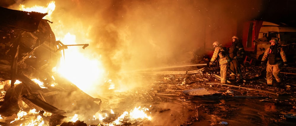 Firefighters work at the site of a logistics hub of a private delivery company hit by Russian missile strikes, amid Russia's attack on Ukraine, in Kharkiv, Ukraine January 13, 2026. REUTERS/Sofiia Gatilova