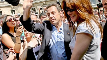 Präsident Sarkozy und Frau bei Fete de la Musique