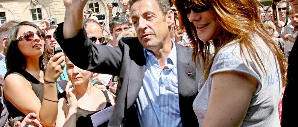 Präsident Sarkozy und Frau bei Fete de la Musique