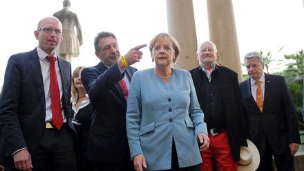 Angela Merkel mit dem dänischen Mohammed-Karikaturisten Kurt Westergaard.