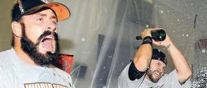 Hoch die Flaschen. Die Giants Brian Wilson (links) and Cody Ross feiern den Titel feucht und fröhlich. Foto: dpa