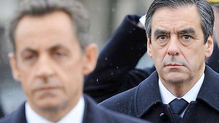 Sarkozys (l.) Mann im Hintergrund: Francois Fillon.