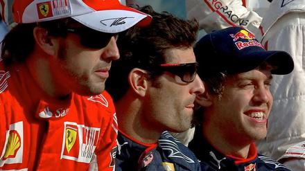 Fernando Alonso (links) hatte vor dem Rennen die besten Chancen auf den Titel, Mark Webber (Mitte) lag dahinter vor dem Deutschen Sebastian Vettel. Der galt eigentlich nur als Außenseiter.