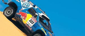 Abfahrtsrennen. Der Südafrikaner Giniel de Villiers fand vor zwei Jahren in der Wüste den schnellsten Weg zum Ziel und gehört auch diesmal wieder zu den Favoriten. Foto: p-a/dpa