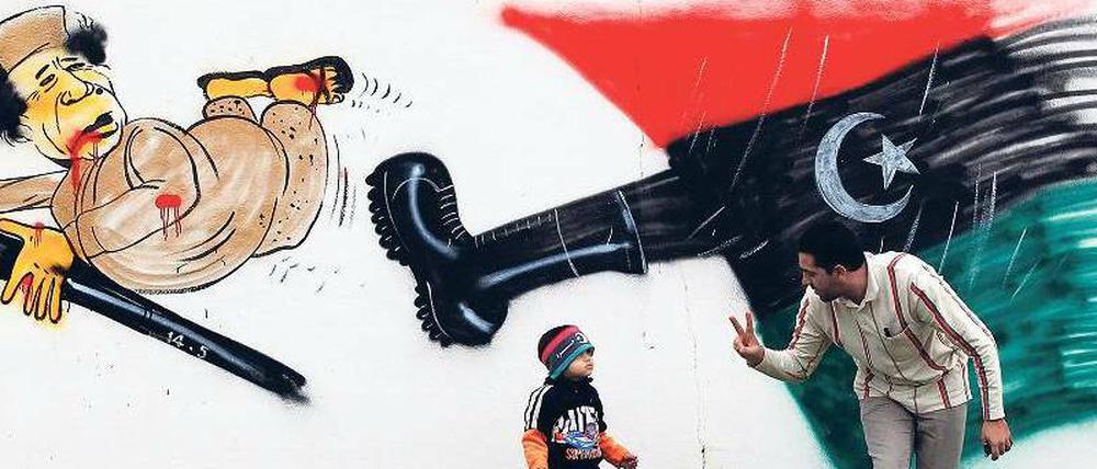 Bild der Freiheit. In der libyschen Stadt Benghasi wird der selbst ernannte Revolutionsführer Gaddafi auf einem Graffiti verspottet.