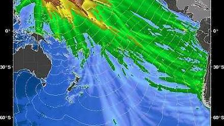 Das Bild der für Seismographie zuständigen US-Behörde zeigt die vermutete Ausdehnung des Tsunami im Pazifik sowie den jeweiligen Scheitel der Flutwelle - grün heißt bis zu einem Viertelmeter, weiß-violett über einen Meter.