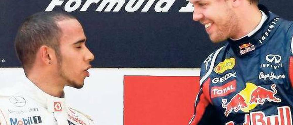 Zur Augenhöhe fehlt ein Stück. Vor dem Rennen in Monaco liegt Lewis Hamilton (l.) 41 Punkte hinter Sebastian Vettel zurück. Foto: Reuters