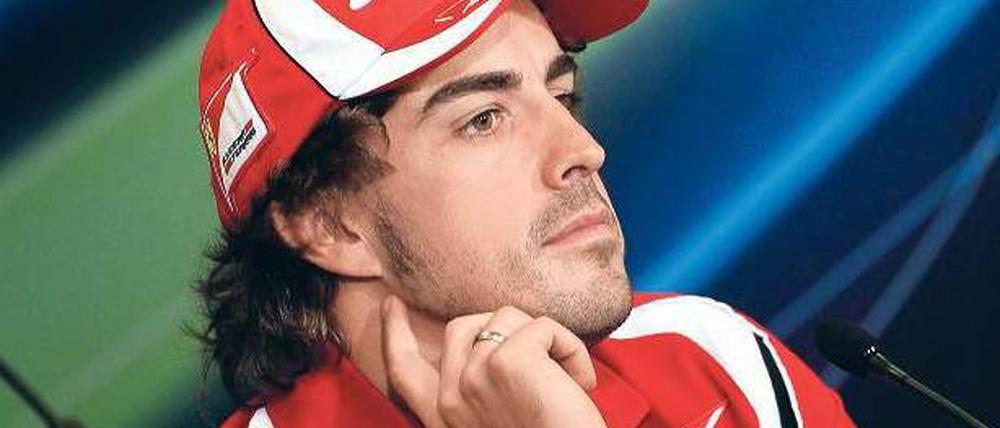 Der Meister denkt. Fernando Alonso kennt keinen besseren Ort als Ferrari. Foto: dpa