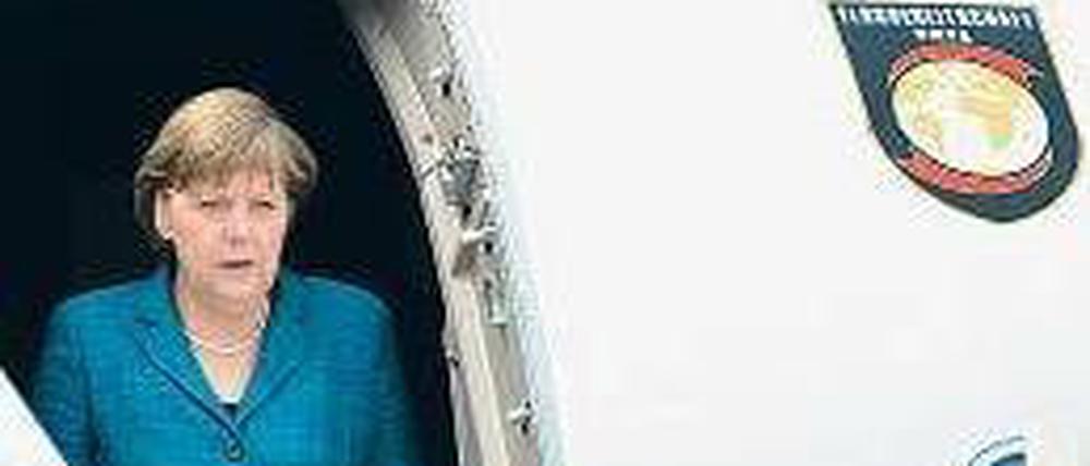 Geschafft. Merkel in Indien. Foto: dpa